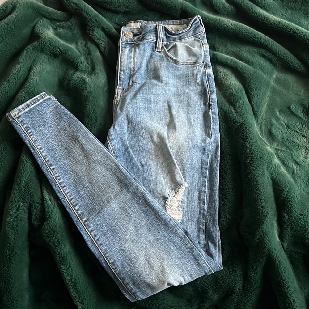 Pacsun high rise skinniest distressed denim. Distressed on both legs.